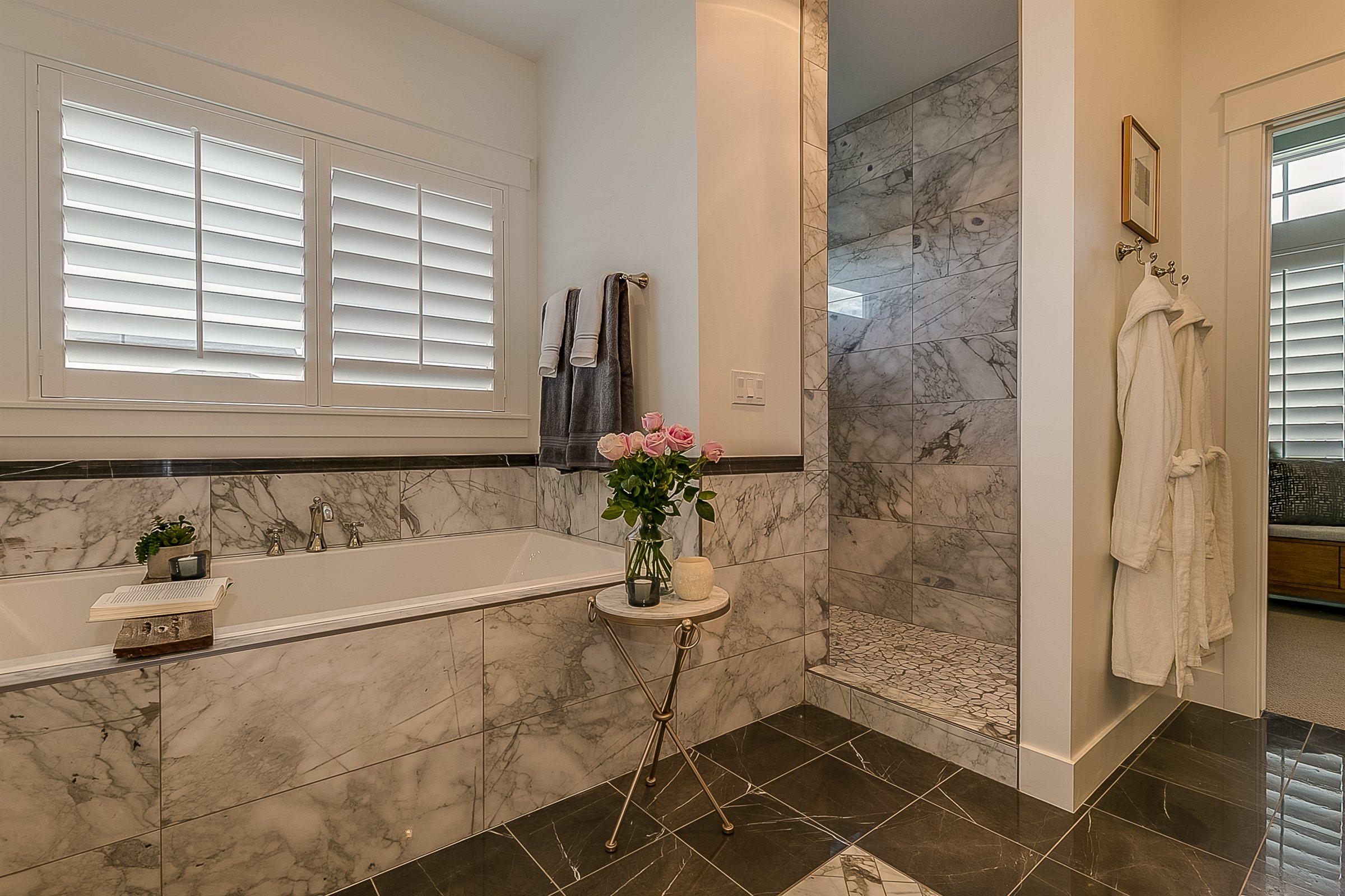 Marble bathroom remodel with a soaking tub and a walk-in shower