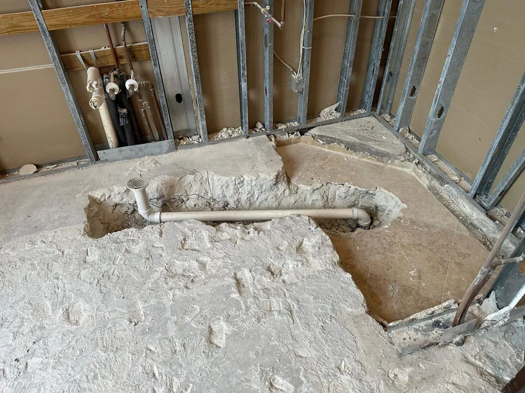 Bathroom stripped to the studs and slab before remodeling in Miami, FL 33165